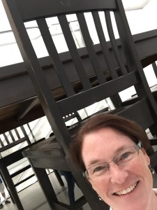 Me beside a chair in Robert Therrien's Under the Table, at the Broad